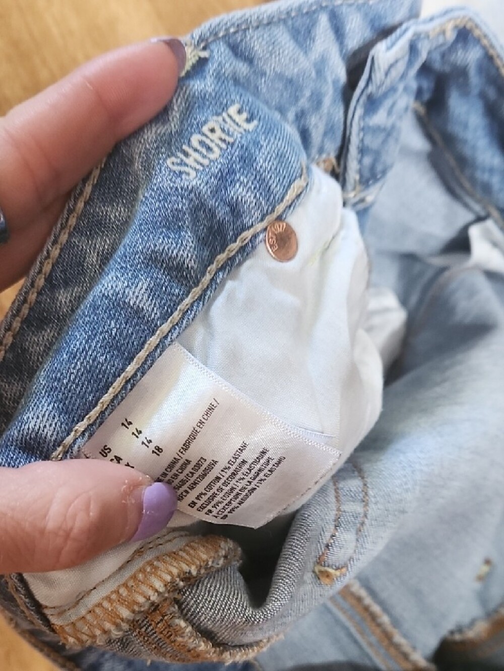 American Eagle Outfitters Light Blue Distressed Denim Shorts with Lace Hem - Picture 2 of 5
